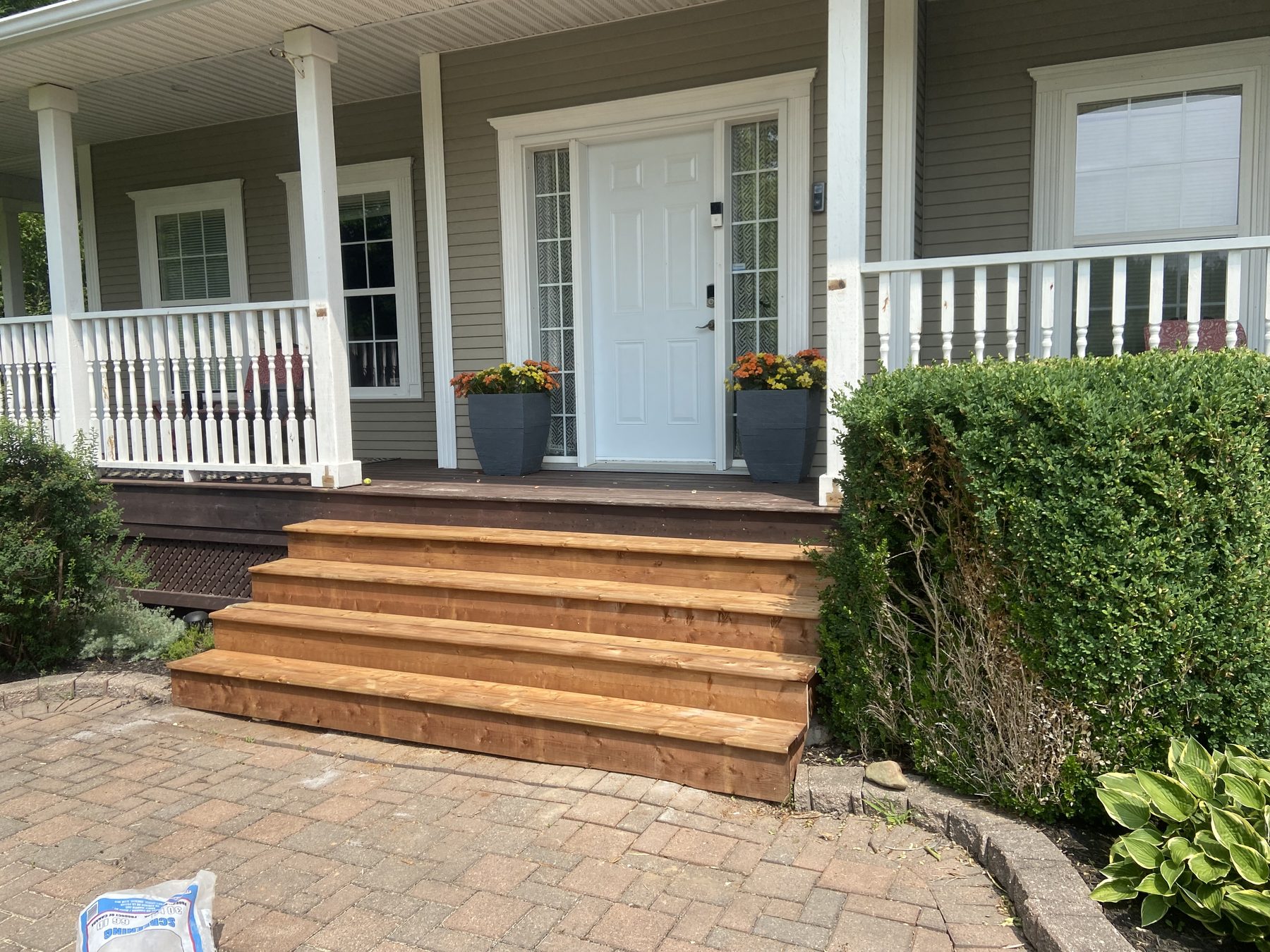 The same entry rebuilt with new pressure-treated stair treads and stringers